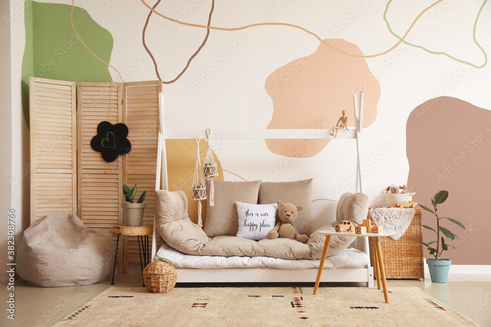 Interior of modern childrens room with comfortable bed