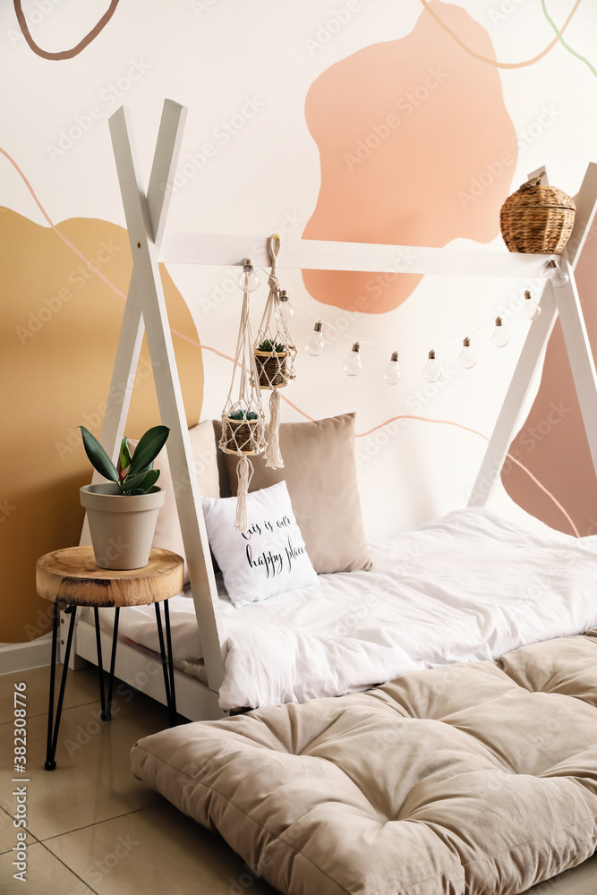 Interior of modern childrens room with comfortable bed