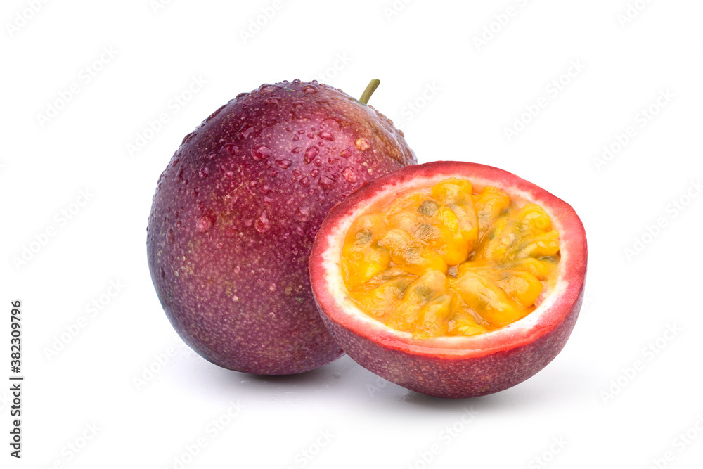 Purple passion fruit with cut in half and  water droplets isolated on white background..