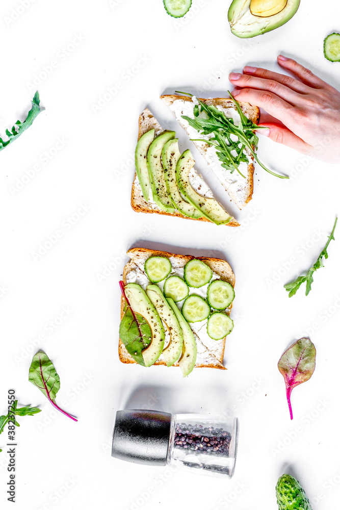 fitness breskfast with homemade sandwiches white table background top view