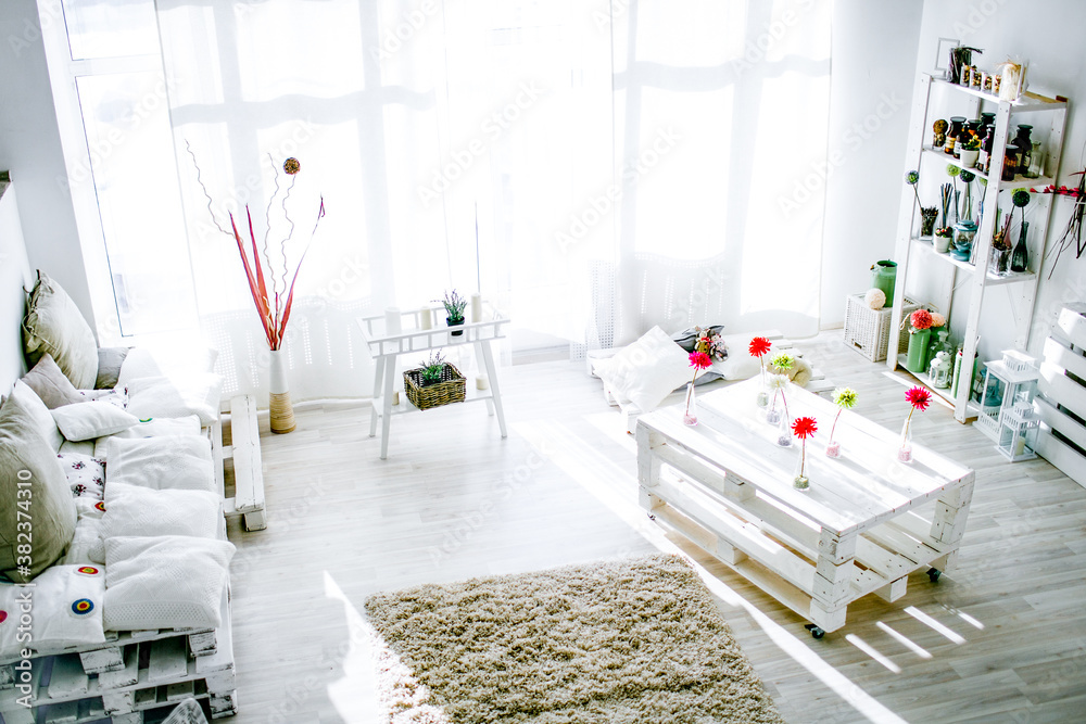 modern white living room interior in sunny morning.