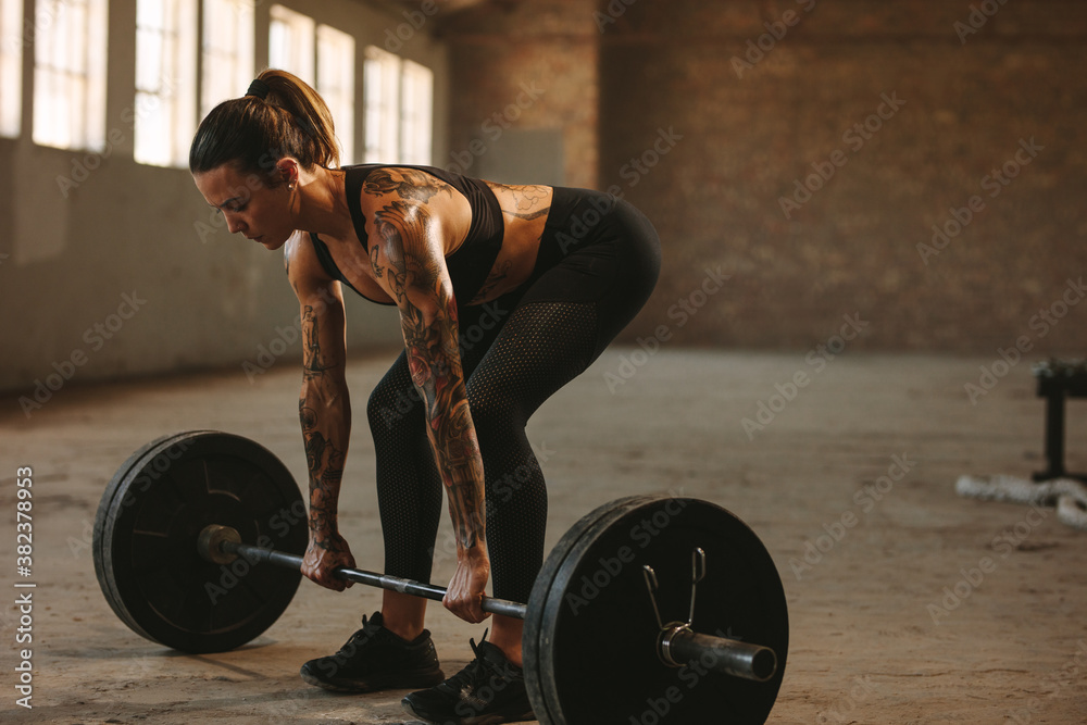 Fitness female doing weightlifting workout