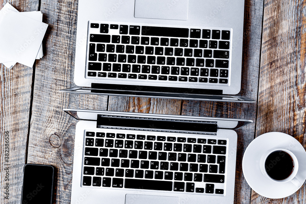 comfy working place for two with notebook on wooden table