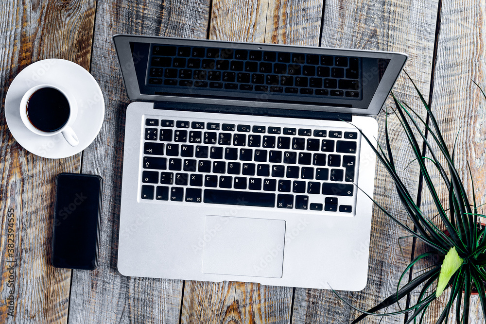 Working place with notebook on wooden table