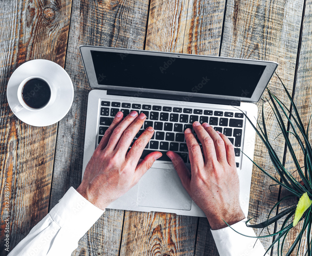 Working place for man with notebook on wooden table