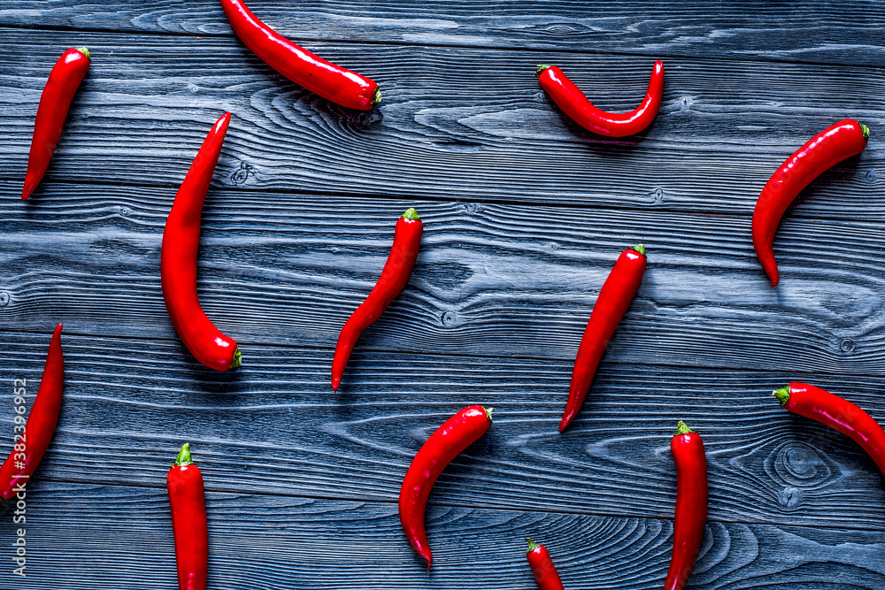 spicy food cooking with red chili wooden table background top view pattern