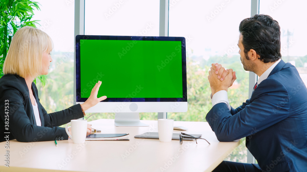 Business people in the conference room with green screen chroma key TV or computer on the office tab