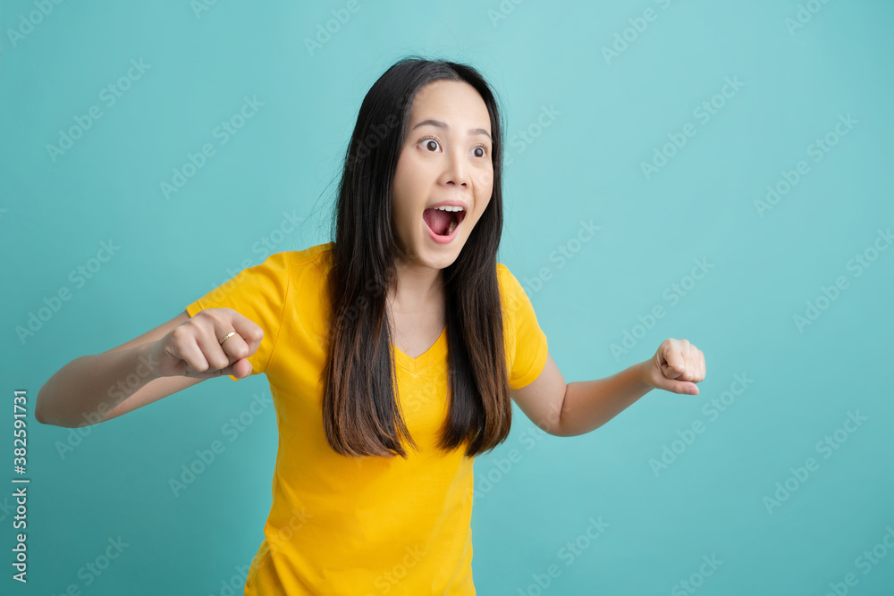 Asian woman making an excited expression