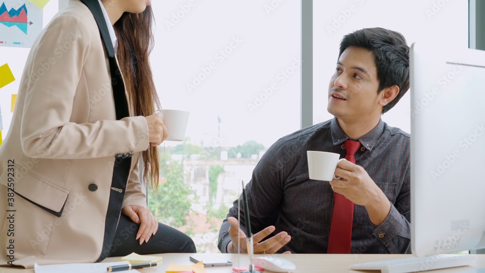 Two business people talk project strategy at office meeting room. Businessman discuss project planni