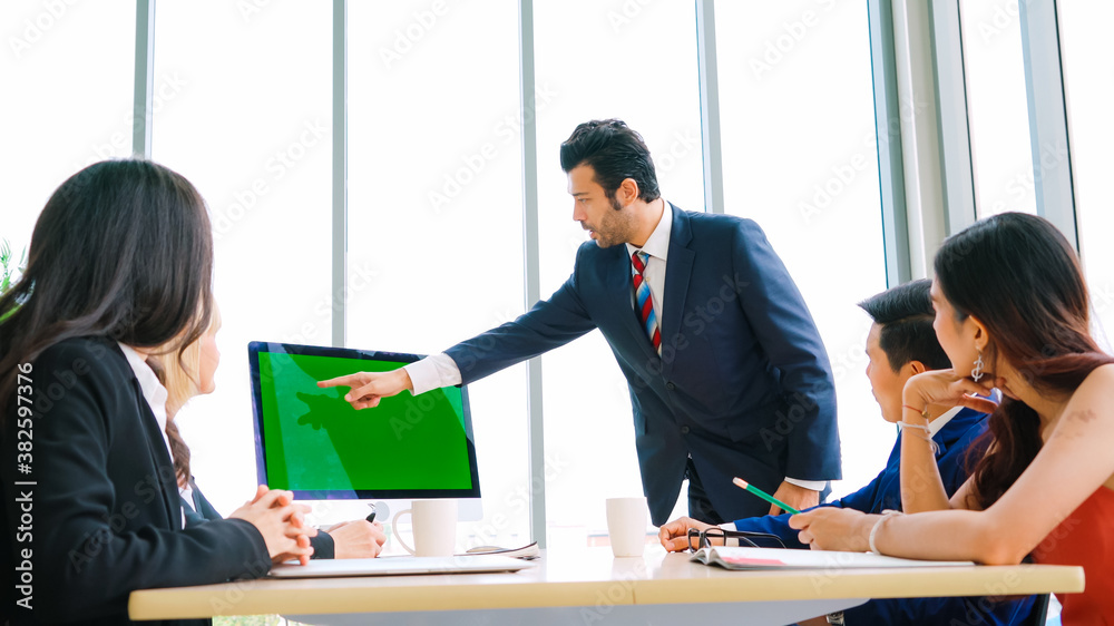 Business people in the conference room with green screen chroma key TV or computer on the office tab