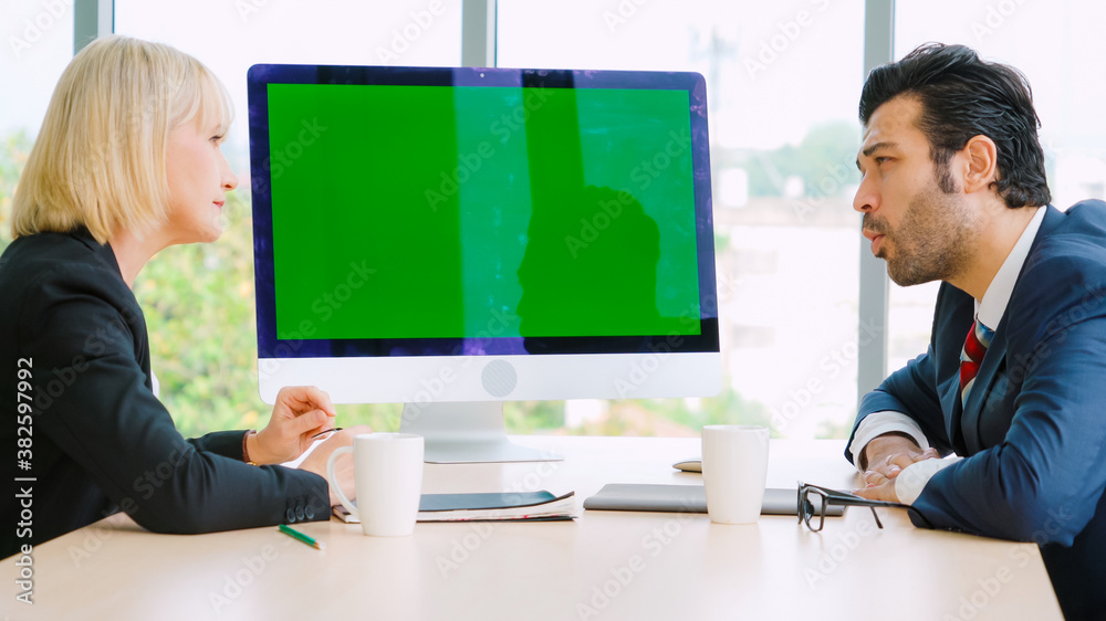 Business people in the conference room with green screen chroma key TV or computer on the office tab