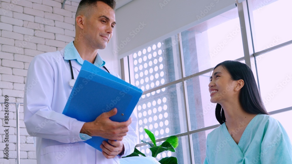 Doctor in professional uniform examining patient at hospital or medical clinic. Health care , medica