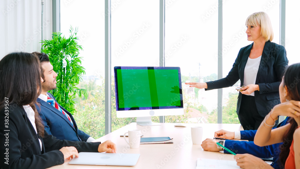 Business people in the conference room with green screen chroma key TV or computer on the office tab