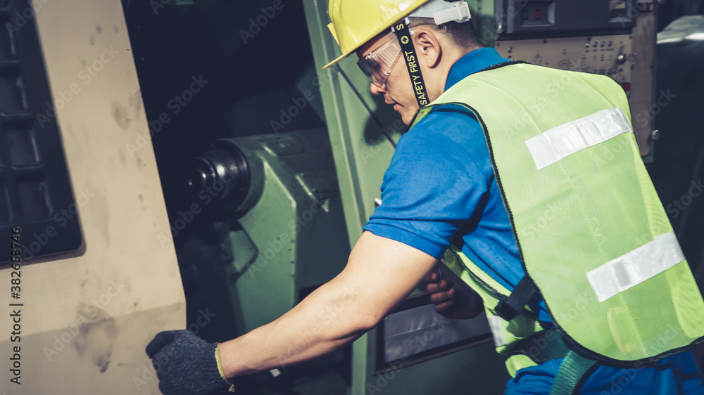 Smart factory worker using machine in factory workshop . Industry and engineering concept.