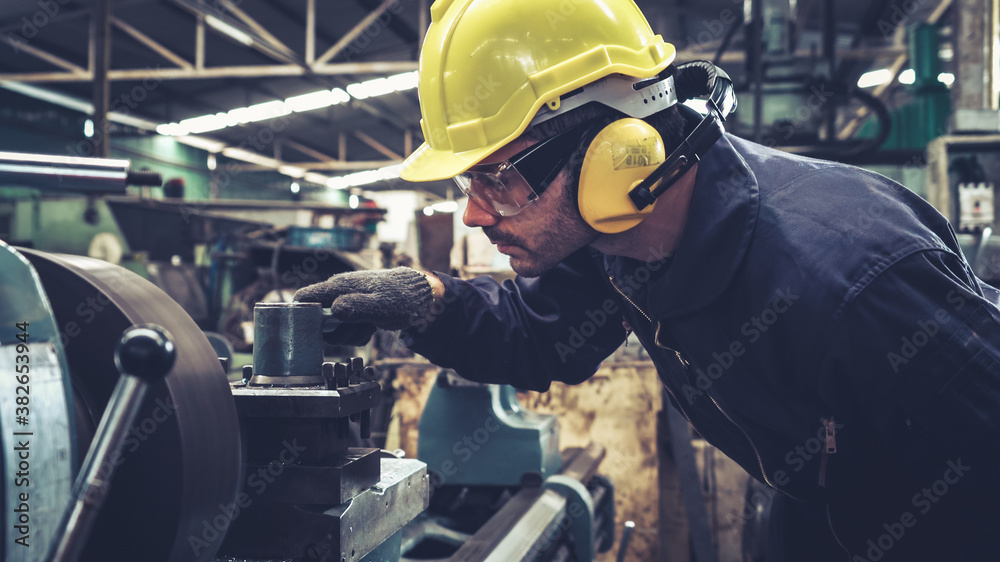 Smart factory worker using machine in factory workshop . Industry and engineering concept.