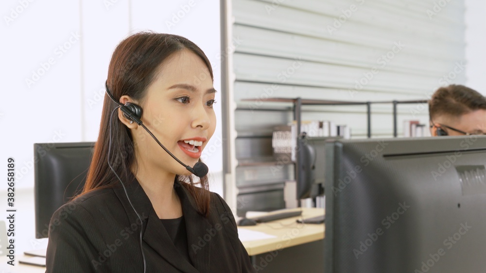 Business people wearing headset working in office to support remote customer or colleague. Call cent