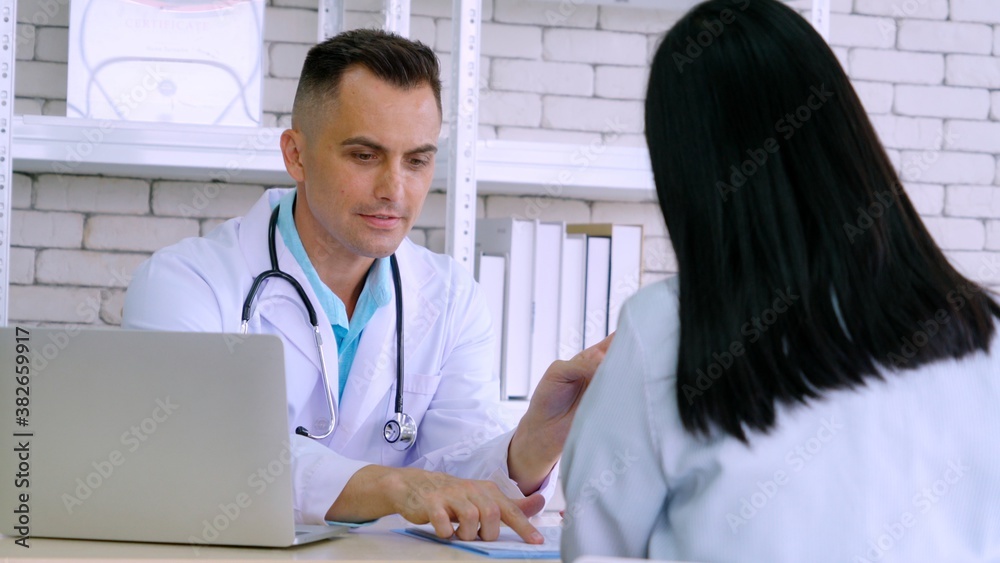 Doctor in professional uniform examining patient at hospital or medical clinic. Health care , medica