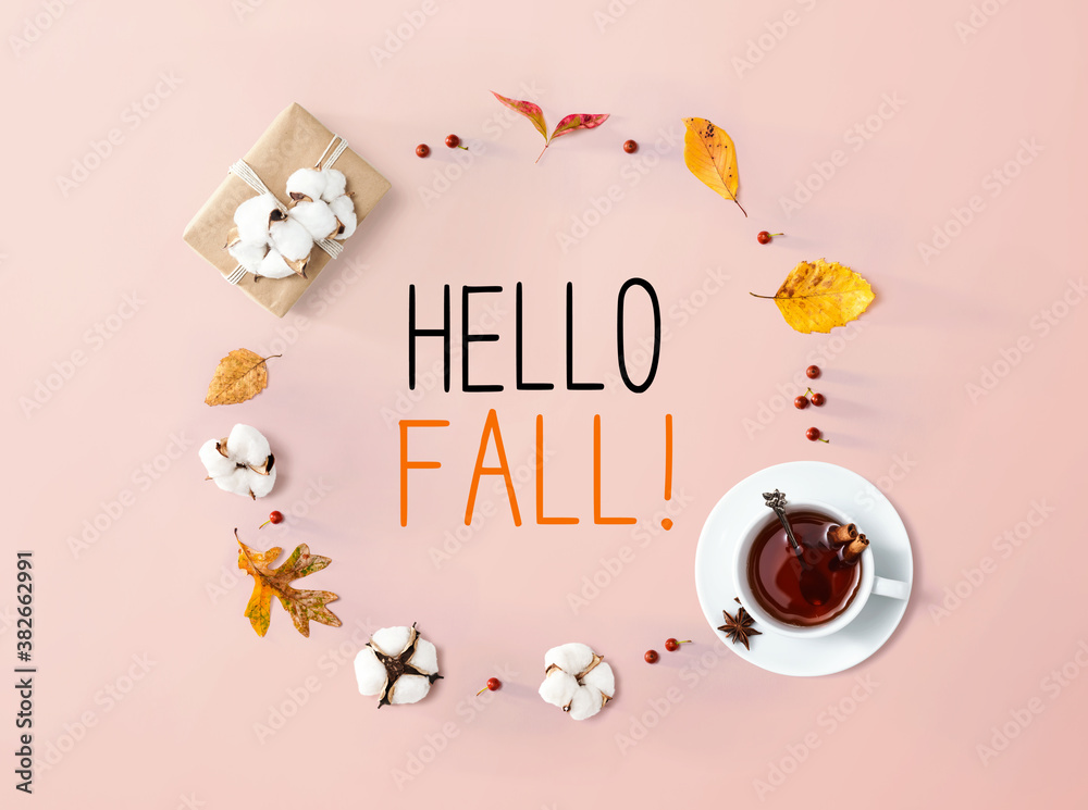 Hello fall message with autumn leaves and cinnamon tea