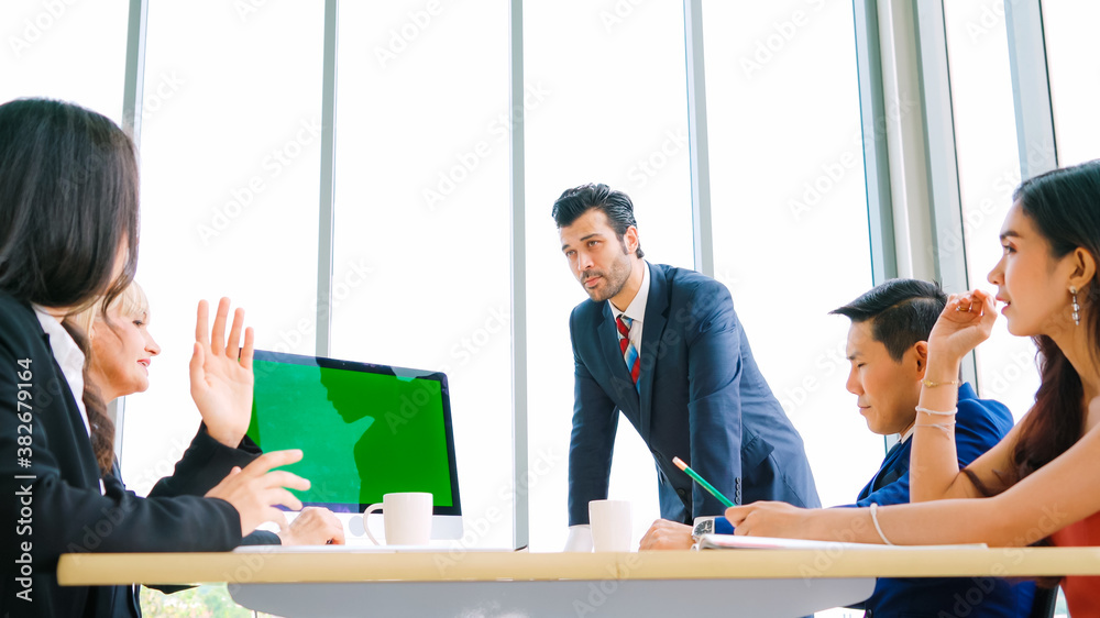 Business people in the conference room with green screen chroma key TV or computer on the office tab