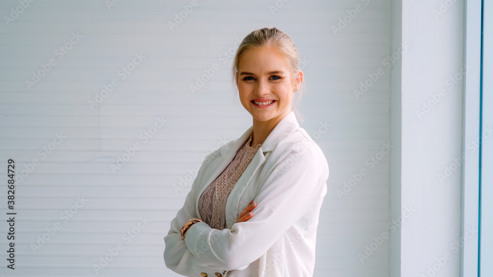 Attractive young woman profile portrait in office . Confident business person wearing formal suit wo