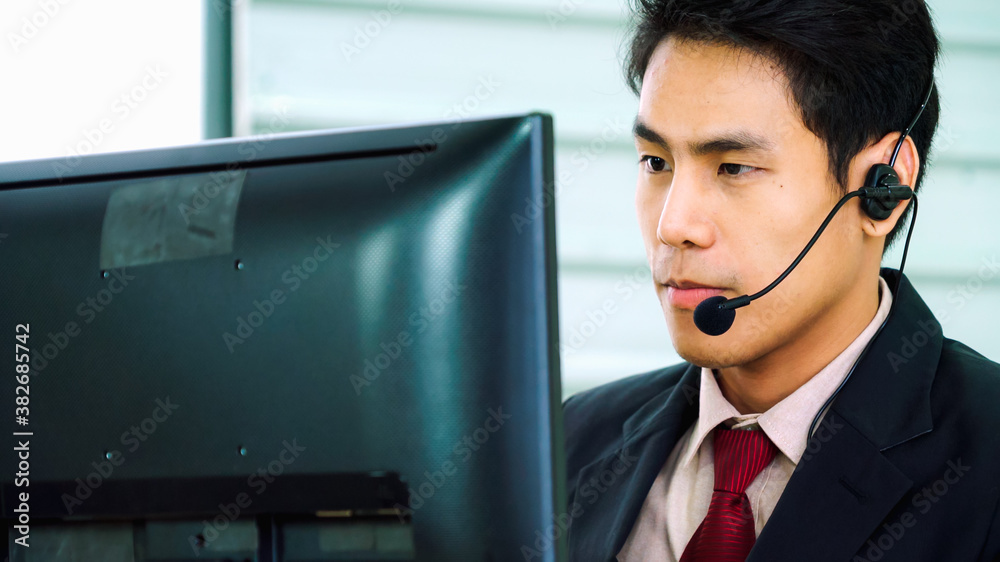 Business people wearing headset working in office to support remote customer or colleague. Call cent