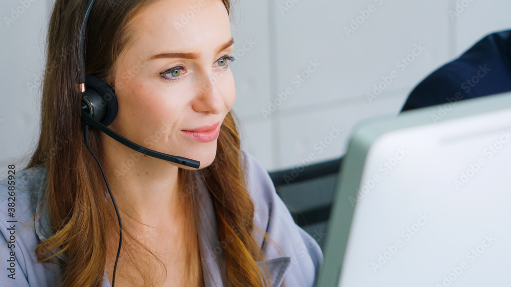 Business people wearing headset working in office to support remote customer or colleague. Call cent