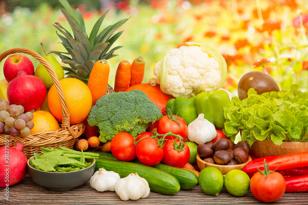 Group vegetables and Fruits Apples, grapes, oranges, pineapples, bananas in a wooden basket with car