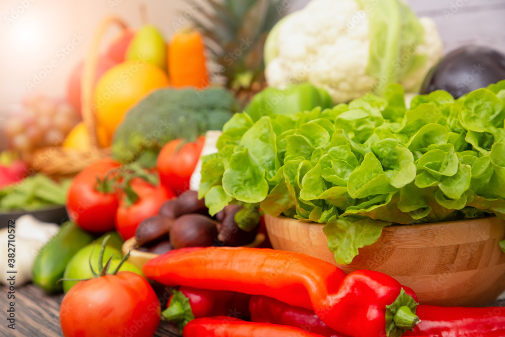 Group vegetables and Fruits Apples, grapes, oranges, pineapples, bananas in a wooden basket with car