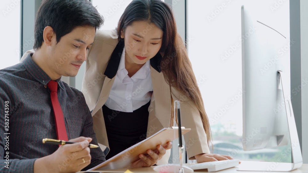 Two business people talk project strategy at office meeting room. Businessman discuss project planni