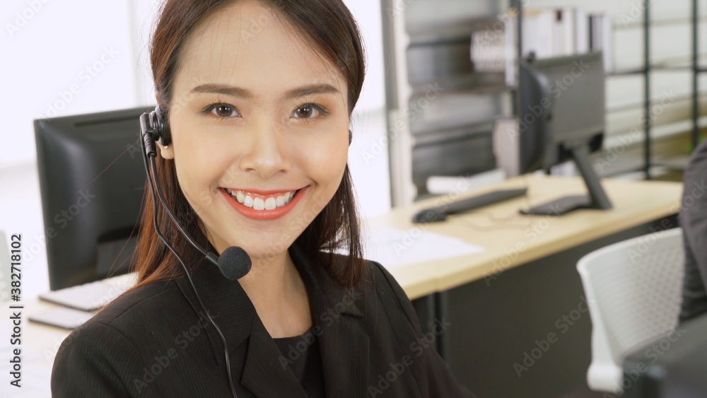 Business people wearing headset working in office to support remote customer or colleague. Call cent