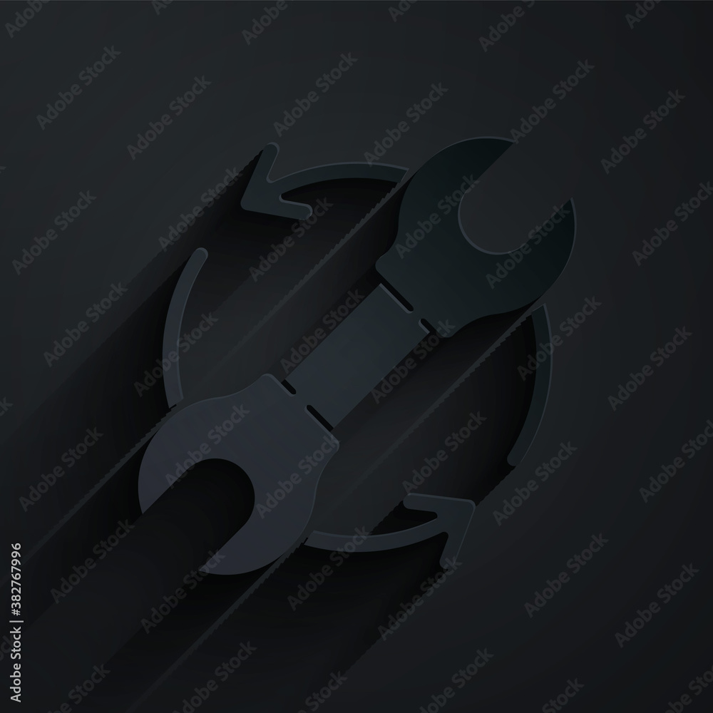 Paper cut Wrench spanner and arrows as workflow icon isolated on black background. Adjusting, servic