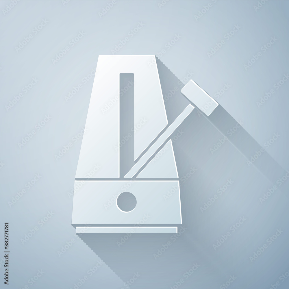 Paper cut Classic Metronome with pendulum in motion icon isolated on grey background. Equipment of m