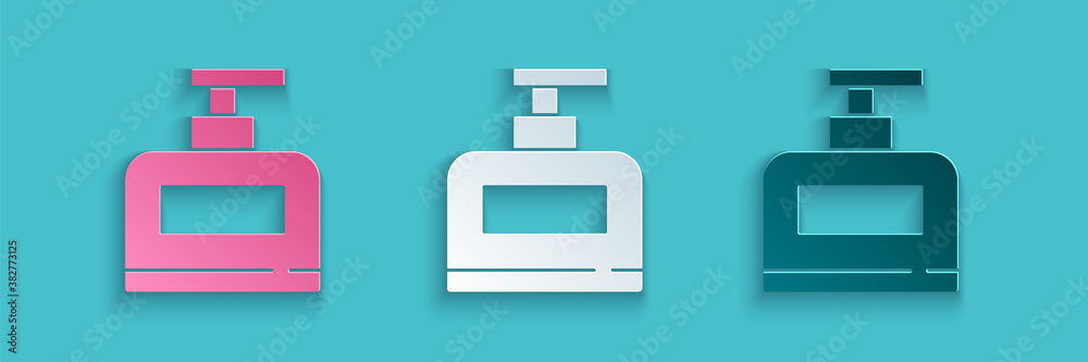 Paper cut Bottle of shampoo icon isolated on blue background. Paper art style. Vector.