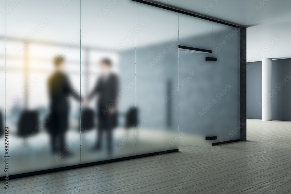 Side view of businessmen shaking hands in modern office interior