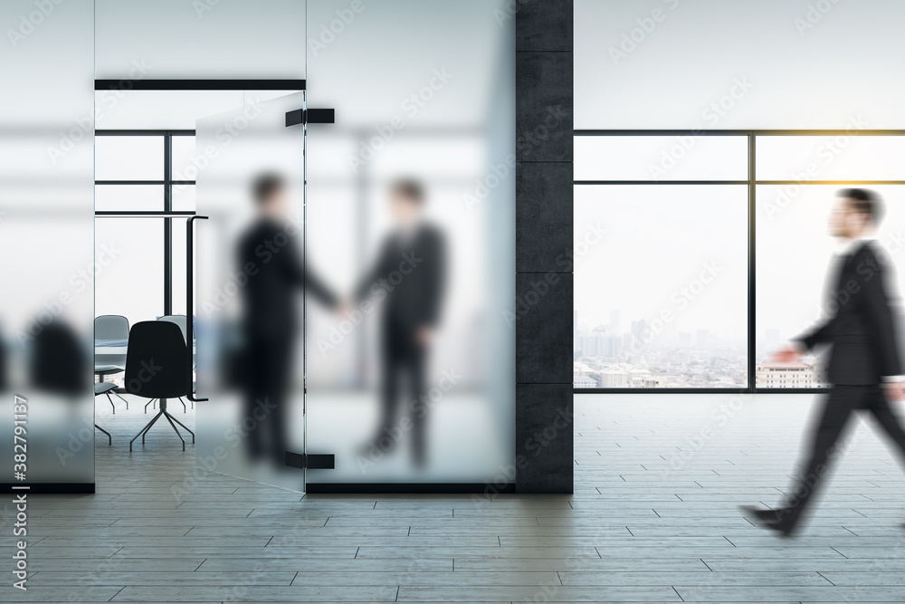 Thoughtful young businesspeople shaking hands