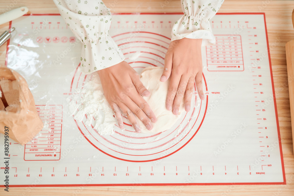 Woman prepares a cake for baking. Photo bright and filtered instagram style.