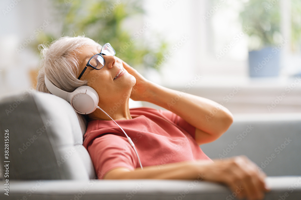 Senior woman listening to music