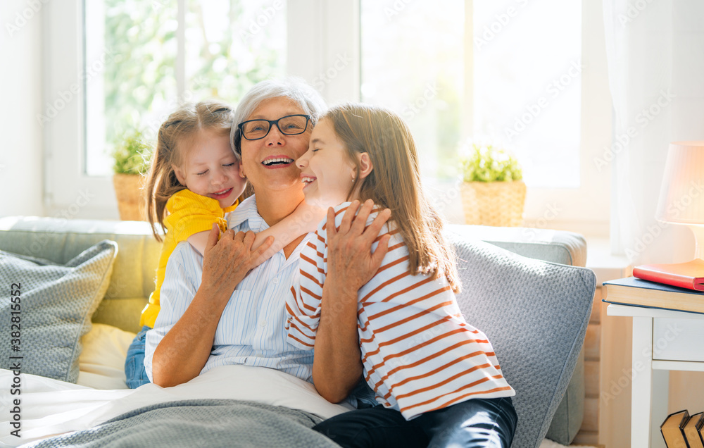 girls and their grandmother enjoying sunny morning