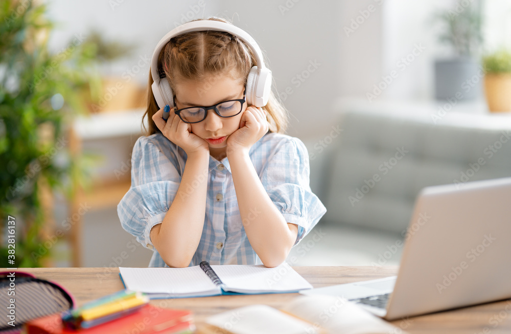 Girl doing homework or online education.