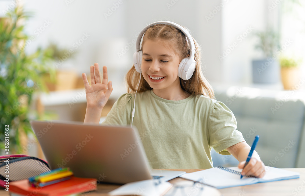 Girl doing homework or online education.