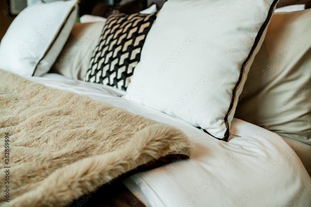 close up white beige soft pillows on bed and blanket bedroom interior design concept.bed maid luxury