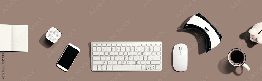 Computer keyboard with digital devices - flat lay