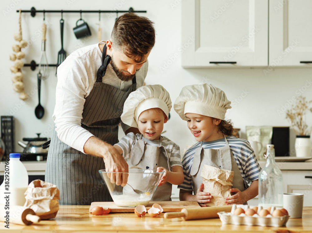 Father and kids preparing pastry together.