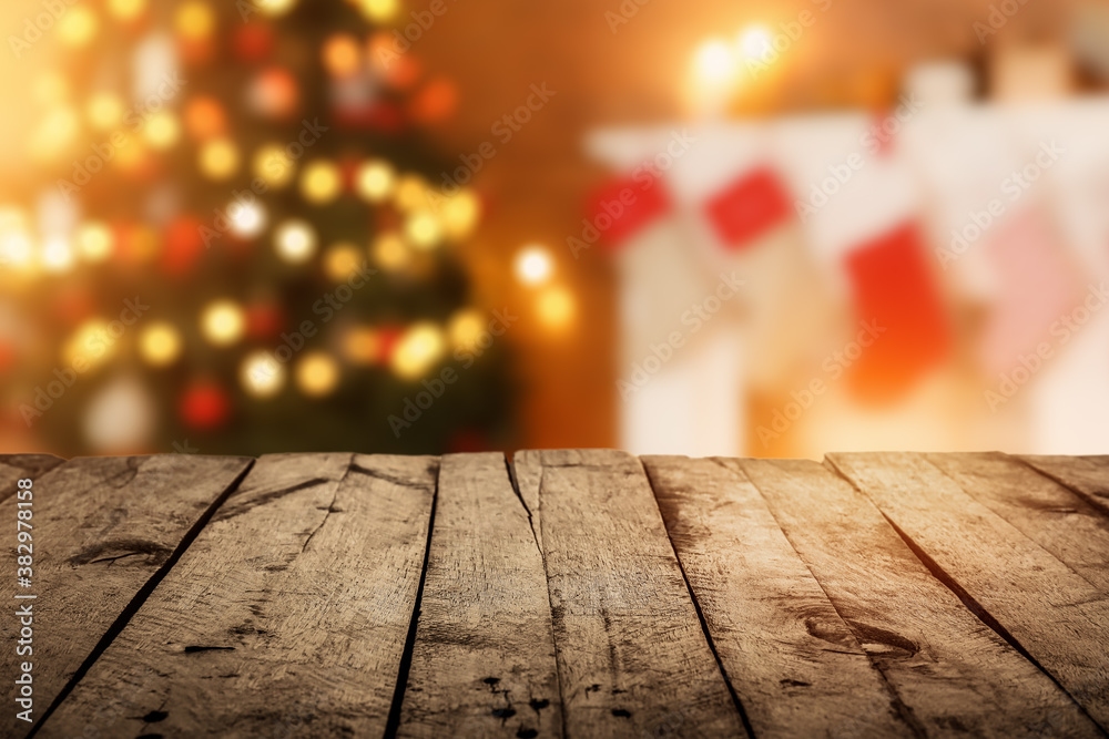 Closeup view of wooden table against blurred Christmas interior