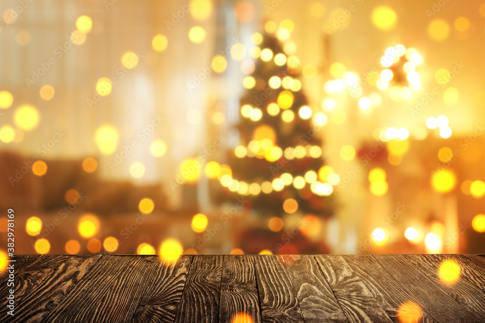 Closeup view of wooden table against blurred Christmas interior