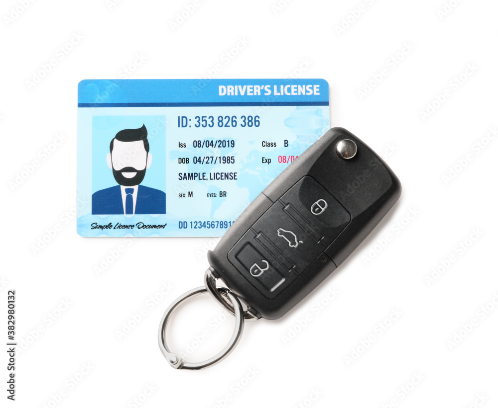 Driving license with car key on white background