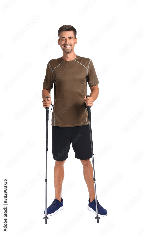 Young man with walking poles on white background