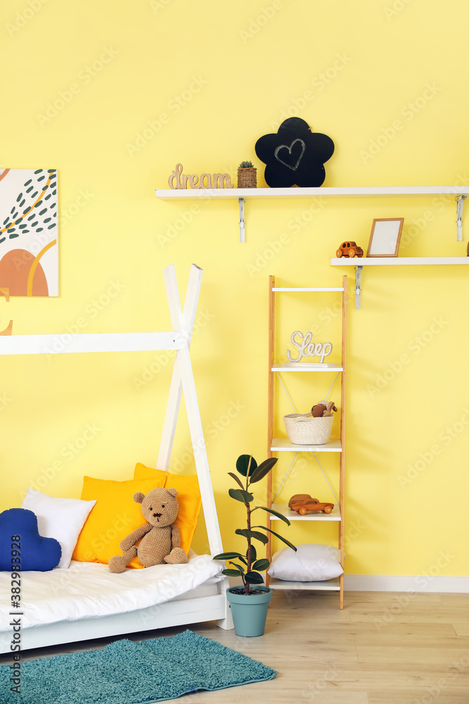 Interior of modern childrens room with comfortable bed