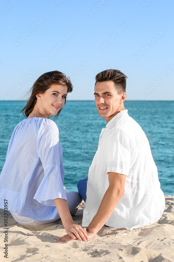 Happy young couple on sea beach