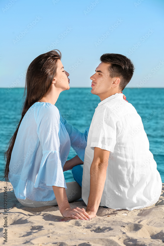 Happy young couple on sea beach